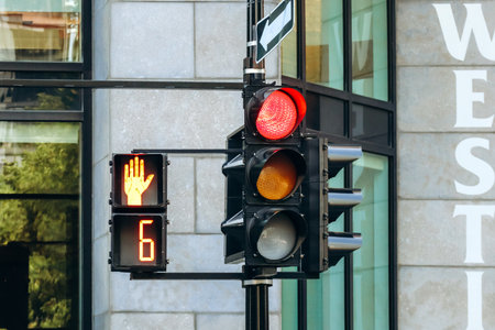 Montreal, Canada - August 14, 2025: downtown traffic light and red pedestrian stop signal at...