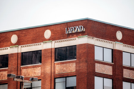 Montreal, Canada - August 14, 2025: facade of Lafond company building in downtown Montreal with red...