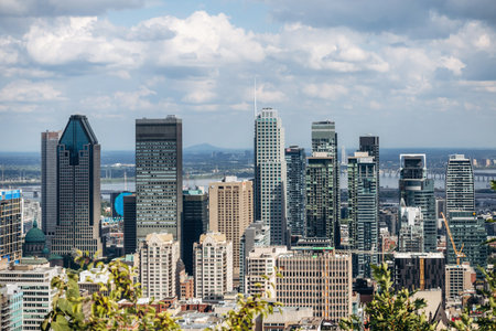 Montreal, Canada - August 15, 2025: City skyline with office towers and residential buildings seen from Kondiaronk Belvedereのeditorial素材
