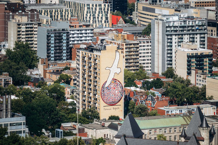 Montreal, Canada - August 15, 2025: Large mural on a building facade seen from Kondiaronk Belvedereのeditorial素材