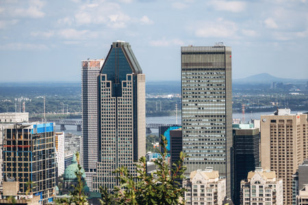 Montreal, Canada - August 15, 2025: City skyline with office towers and residential buildings seen from Kondiaronk Belvedereのeditorial素材