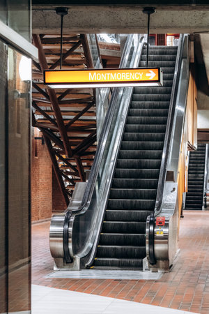 Montreal, Canada â€“ August 15, 2025: Metro station escalator with Montmorency sign