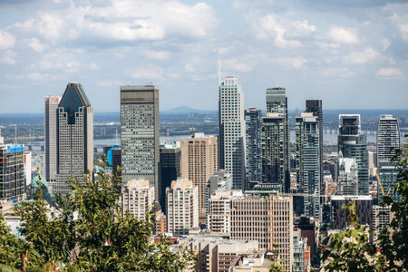 Montreal, Canada - August 15, 2025: City skyline with office towers and residential buildings seen from Kondiaronk Belvedereのeditorial素材