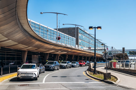 Montreal, Canada - August 15, 2025: Exterior roadway and terminal buildings at the airport on a clear summer dayのeditorial素材