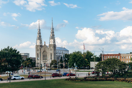 Ottawa, Canada - August 13, 2025: View of Notre Dame Cathedral Basilica in downtown Ottawa with twin spires and surrounding cityscapeのeditorial素材