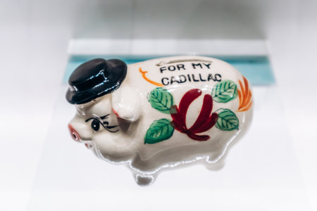 Ottawa, Canada - August 13, 2025: Vintage ceramic piggy bank with the inscription âFor My Cadillac,â displayed in the Bank of Canada Museum in Ottawa, Canadaのeditorial素材