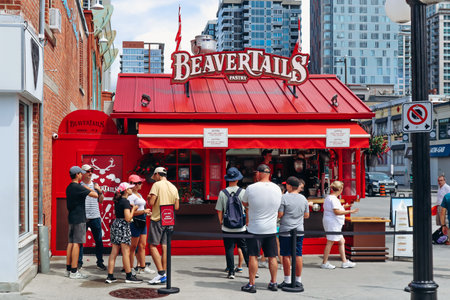 Ottawa, Canada - August 13, 2025: Beavertails kiosk in central Ottawa with people lining up for...