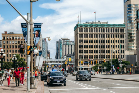 Ottawa, Canada â August 13, 2025: Central Ottawa street with traffic, pedestrians, and office buildingsのeditorial素材