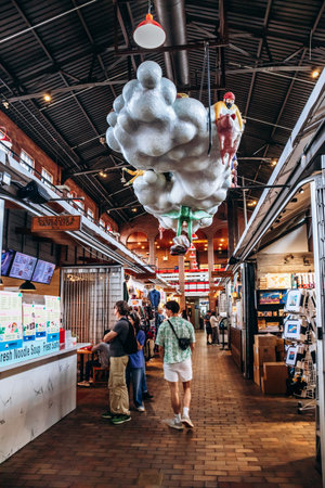 Ottawa, Canada - August 13, 2025: Interior of ByWard Market with hanging sculpture, shops, and visitorsのeditorial素材
