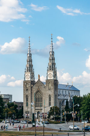 Ottawa, Canada - August 13, 2025: View of Notre Dame Cathedral Basilica in downtown Ottawa with twin spires and surrounding cityscapeのeditorial素材