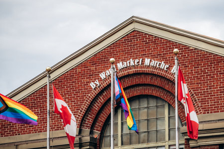 Ottawa, Canada - August 13, 2025: ByWard Market building with Canada and pride flags in central Ottawaのeditorial素材