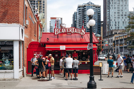 Ottawa, Canada - August 13, 2025: Beavertails kiosk in central Ottawa with people lining up for handmade pastriesのeditorial素材