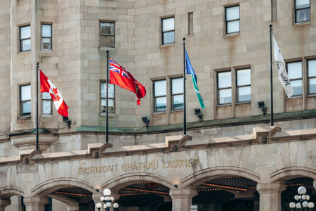 Ottawa, Canada - August 13, 2025: Entrance of Fairmont Chateau Laurier with flags in downtown Ottawaのeditorial素材