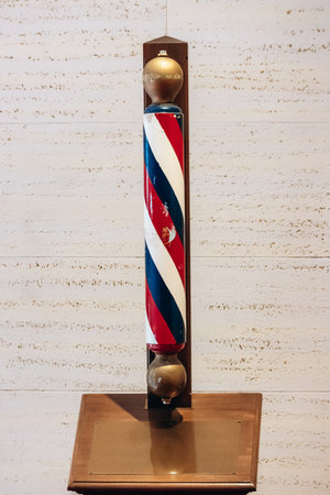 Ottawa, Canada - August 13, 2025: Historic wooden barber pole from the former Senate Barber Shop, displayed inside the Senate of Canada Building in Ottawa, Canada, dating from the 1940s.のeditorial素材