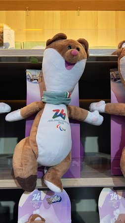 Milan, Italy â January 31, 2026: Official Milano Cortina 2026 merchandise with Winter Olympic and Paralympic Games emblems displayed for sale in a branded souvenir storeのeditorial素材