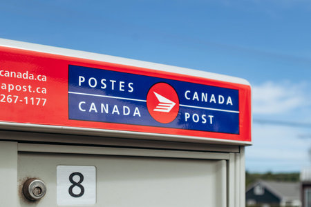 Saguenay, Canada - August 20, 2025: Close-up of Canada Post logo on community mailbox in Quebecのeditorial素材