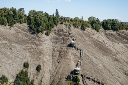 Beauport, Canada - August 22, 2025: Wooden stairway trail and observation platforms on steep cliff at Parc de la Chute Montmorency near Montmorency Falls in Quebec City regionのeditorial素材