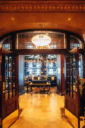 Quebec City, Canada - August 23, 2025: Interior of Fairmont Le Chateau Frontenac hotel lobby with grand staircase, chandeliers, seating areas and reception desk with guests indoorsのeditorial素材