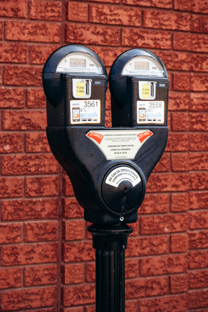 Drummondville, Canada - August 24, 2025: Close-up of a public parking meter installed on the street...