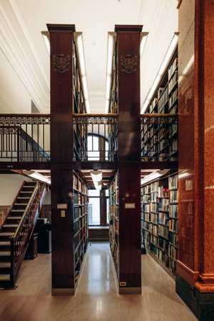 Quebec City, Canada - August 23, 2025: Historic library interior with tall book shelves and marble...
