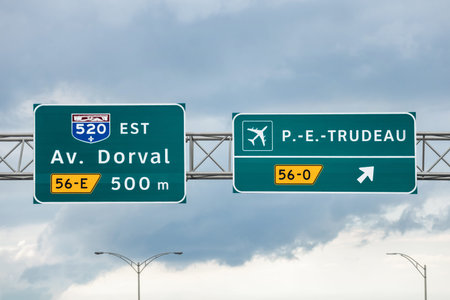 Montreal, Canada - August 24, 2025: Highway sign indicating exit to Pierre Elliott Trudeau...
