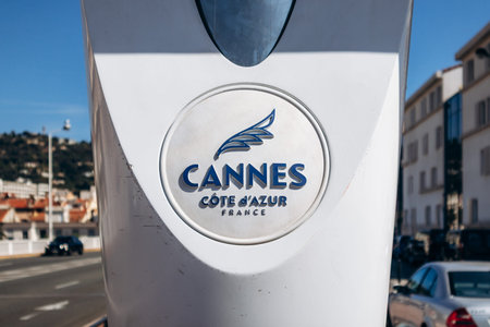 Cannes, France - September 15, 2025: Cannes Cote d Azur France city logo with palm leaf symbol installed on a public street structure along Boulevard d Alsace in Cannes on the French Rivieraのeditorial素材