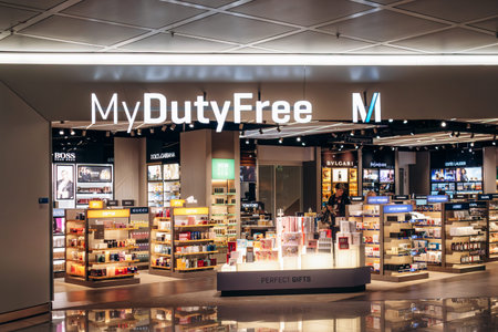 Munich, Germany - April 15, 2025: MyDutyFree store inside Munich Airport with illuminated displays...