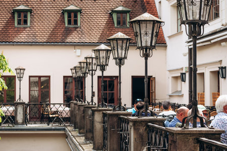 Munich, Germany - April 15, 2025: Historic courtyard with traditional lanterns and outdoor seating at the Hofbrauhaus beer hall in Munich, Bavaria, Germanyのeditorial素材