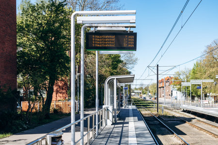 Hanover, Germany - April 22, 2026: Tram stop platform with digital timetable display showing departures to Hannover Hauptbahnhof in Hanover, Germany