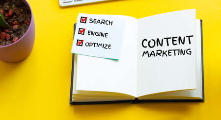 Socail media icons on work desk of managment expert. CONTENT MARKETING. Yellow background top