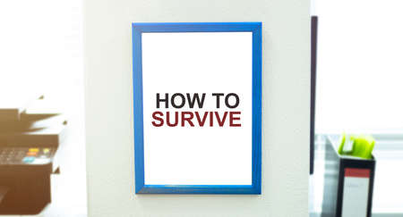 blank showcase billboard with HOW TO SURVIVE text or media content with blurred image of ticket sales counter at movie theater, advertisement, marketing, entertainment conceptの写真素材