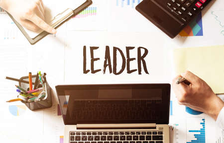 LEADER TEXT.Business team hands at work with financial documentsの写真素材