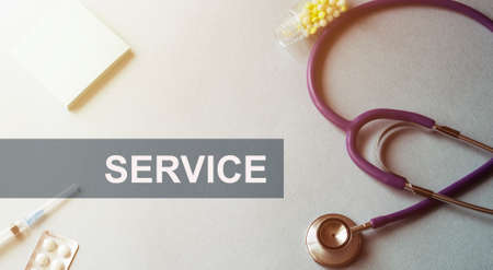 Stethoscope, Syringe, pills and notepad. ACID REFLUX TEXTの写真素材