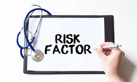Risk Factor card in hands of Medical Doctorの写真素材