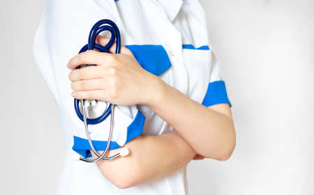 Medicine doctor with stethoscope in hand on hospital background, Medical technology, Healthcare and Medical conceptの写真素材