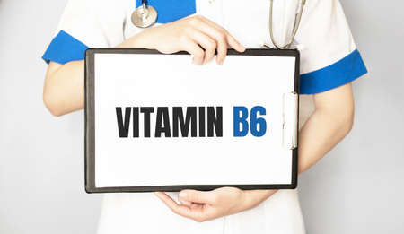The female doctor, with the plate Vitamin B6, medical conceptの写真素材