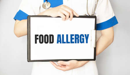 Doctor holding a card with Food Allergy, Medical conceptの写真素材