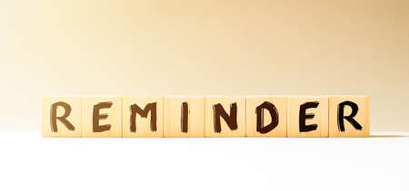 Word REMINDER made with wood building blocksの写真素材