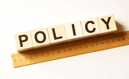 Word POLICY made with wood building blocksの写真素材