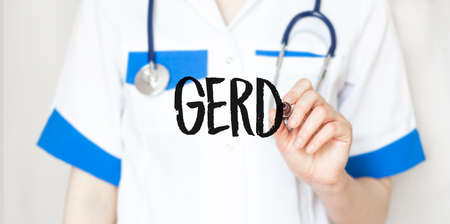 Doctor writing word GERD with marker, Medical conceptの写真素材