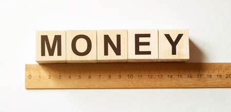 Word money made with wood building blocksの写真素材