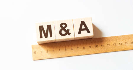 Word M AND A made with wood building blocksの写真素材