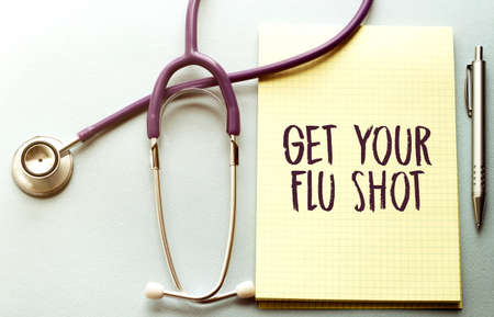 get your flu shot written on a clipboard, Medical conceptの写真素材