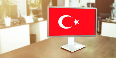 Monitor in modern office with turkey flag on the screenの写真素材