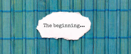 Word the beginning on the piece of paper on the green wood backgroundの写真素材