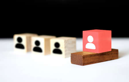 Human resources management and recruitment business build team concept, Hand putting wood cube block on top, Copy spaceの写真素材