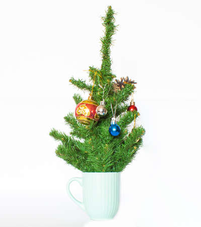 Coffee cup with Christmas tree. Minimal winter holidays concept.の写真素材