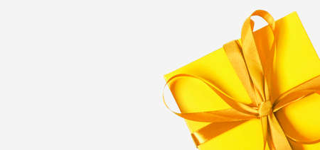 Yellow gift box on white backgrund. Christmas conceptの写真素材
