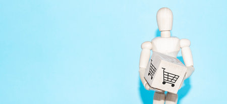 Business and design concept - wooden mannequin with surreal wood cube isolated on white background. the symbol of leadership, communication and successの写真素材