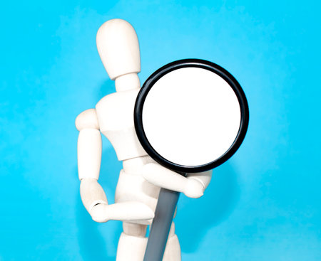 wooden man figure with stethoscope medicine health on gray backgroundの写真素材